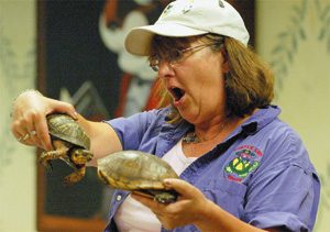 "The Turtle Lady" Nancy Lockard shows children at the Delaware County Library how turtles communicate with each other during her visit to the main branch on Wednesday July 11, 2007.